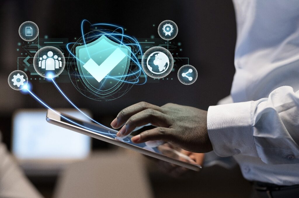 User interacting with digital tablet showing secure tech, symbolizing SAP S/4HANA Implementation Partner in Saudi Arabia, KSA.